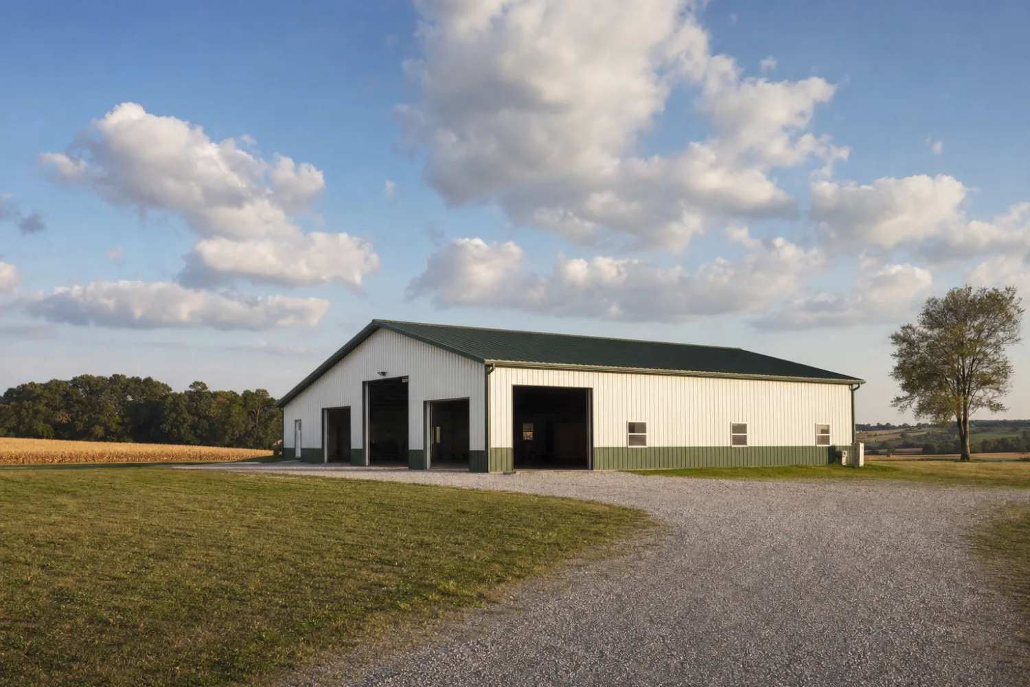 A metal building on an open rural property under a big sky with distant fields