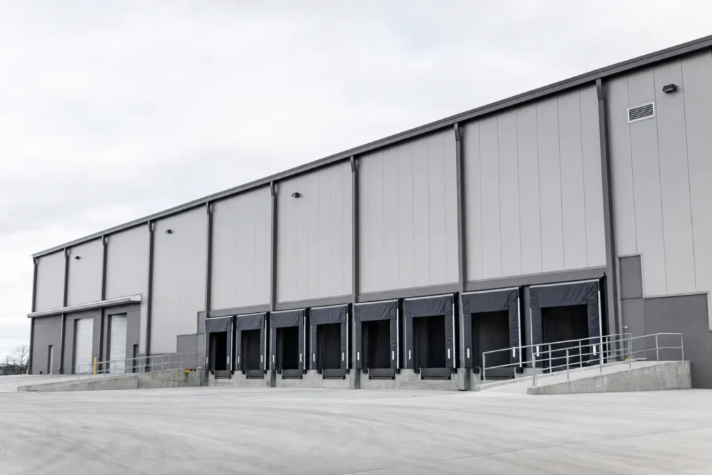 Large commercial metal warehouse building with loading docks